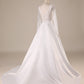 Ivory A Line Tulle Backless Wedding Dress with Long Sleeves V-neck