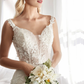 Stunning Wedding Gown with Deep Neckline and Floral Accents Off Shoulder